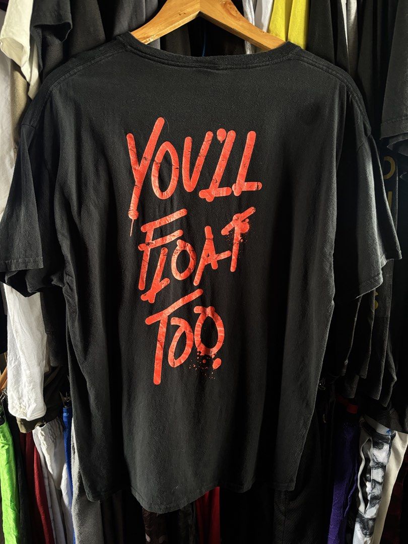 It shirt (Category: Tshirts & Polo Shirts ) located in Taguig. Submitted by nardselect (Listing ID 1461573090, Image 3). Description: It YOU WILL FLOAT shirt Tag Size: L Width: 22 Length: 30 Condition: Good Flaws: Has a small paint stain see on last pic .