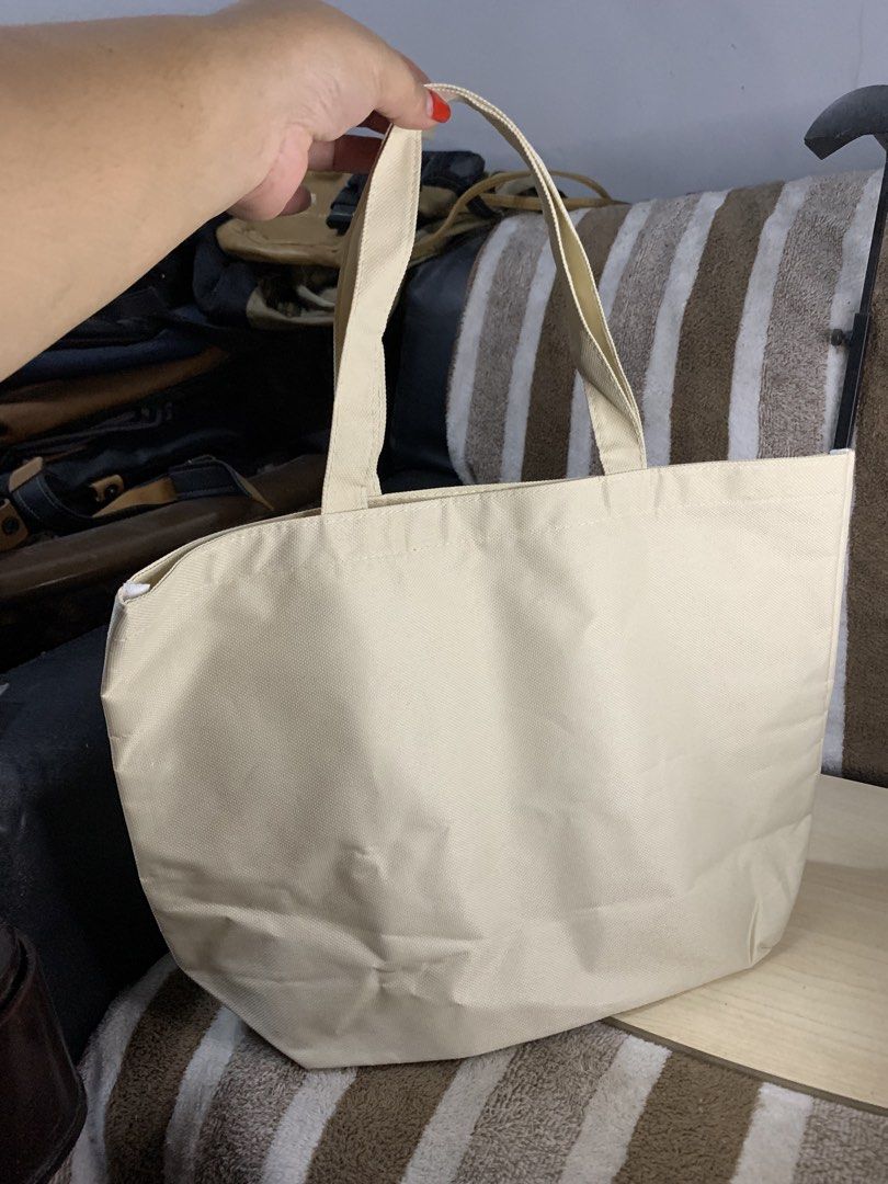 Japan branded handbag (Category: Tote Bags) located in Cabanatuan. Submitted by mjluxxejapan (Listing ID 1461662434, Image 3). Description: Fixed price. Approx 15”x10.5” meas like new cond ndumihan lng konti spacious mediun sz Milky white color. Canvas makapal material .