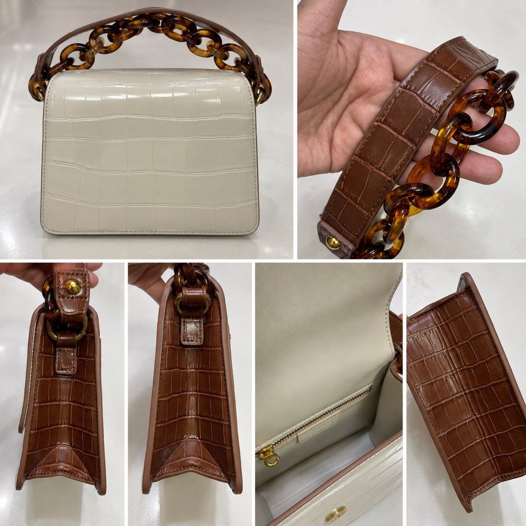 JW PEI EMBOSSED CARAMEL WHITE TOP HANDLE BAG (Category: Purses & Pouches) located in Makati City. Submitted by stylehub.mnl (Listing ID 1461659253, Image 2). Description: Experience a polished, confident look with the JW PEI Crocodile Embossed Top Handle Bag—crafted for an elevated, put-together everyday style with a sleek, structured finish. Closure Type: Design and Style - Crocodile embossed look for a refined, classic feel - Top handle bag sty