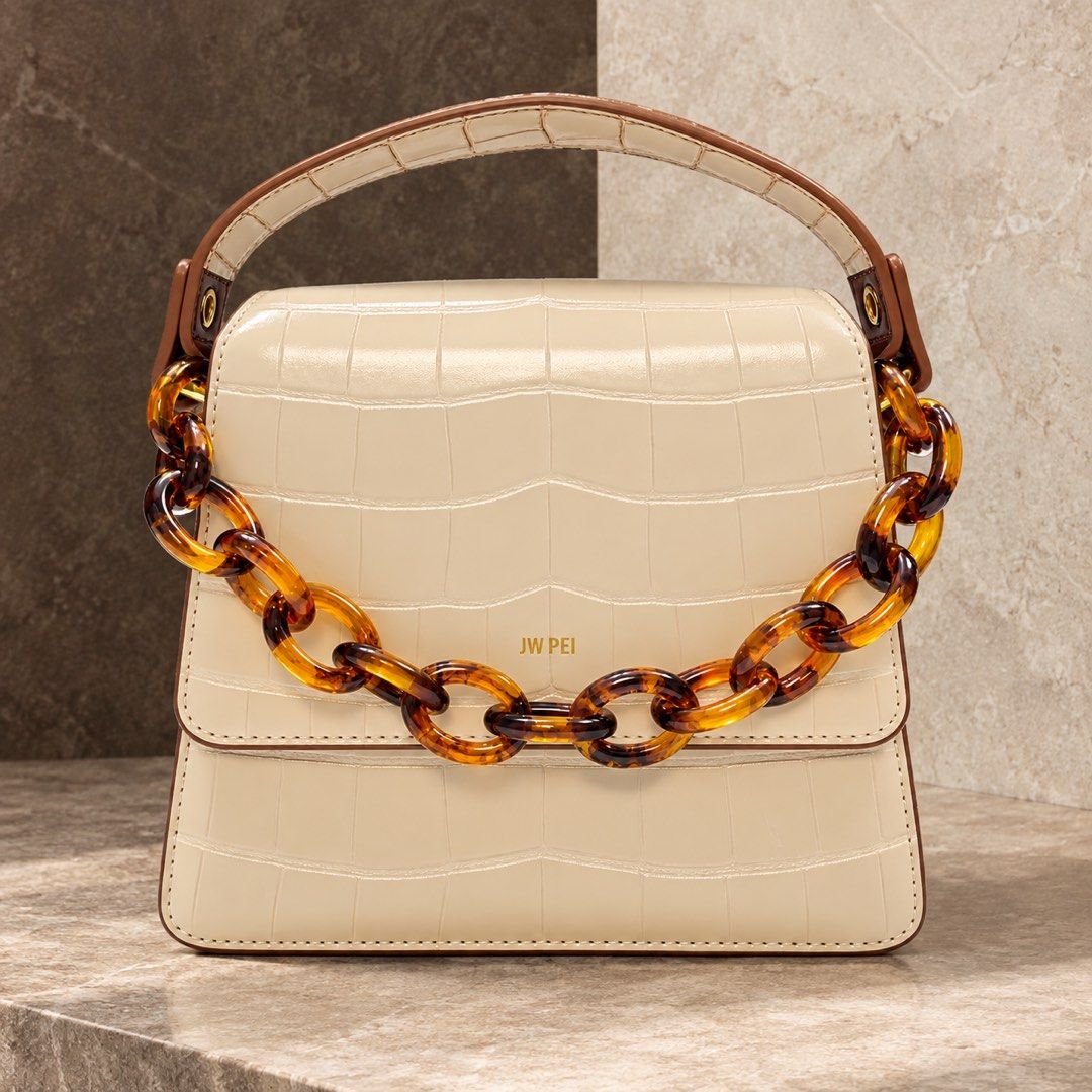 JW PEI EMBOSSED CARAMEL WHITE TOP HANDLE BAG (Category: Purses & Pouches) located in Makati City. Submitted by stylehub.mnl (Listing ID 1461659253, Image 1). Description: Experience a polished, confident look with the JW PEI Crocodile Embossed Top Handle Bag—crafted for an elevated, put-together everyday style with a sleek, structured finish. Closure Type: Design and Style - Crocodile embossed look for a refined, classic feel - Top handle bag sty