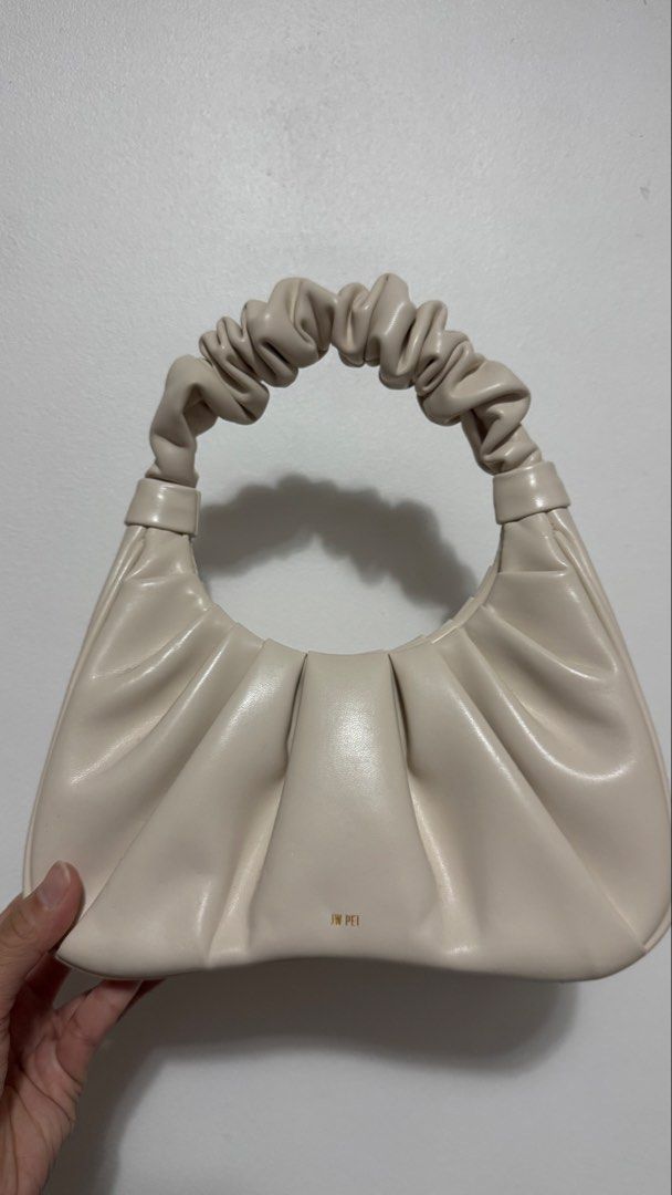JW Pei GABBI Cream Ruched Shoulder Bag (Category: Shoulder Bags) located in Manila. Submitted by patc20 (Listing ID 1461606705, Image 3). Description: - Cream-colored JW Pei handbag - Features a stylish ruched handle - Made from soft, supple leather - Interior card slot for essentials - Ideal for everyday wear.