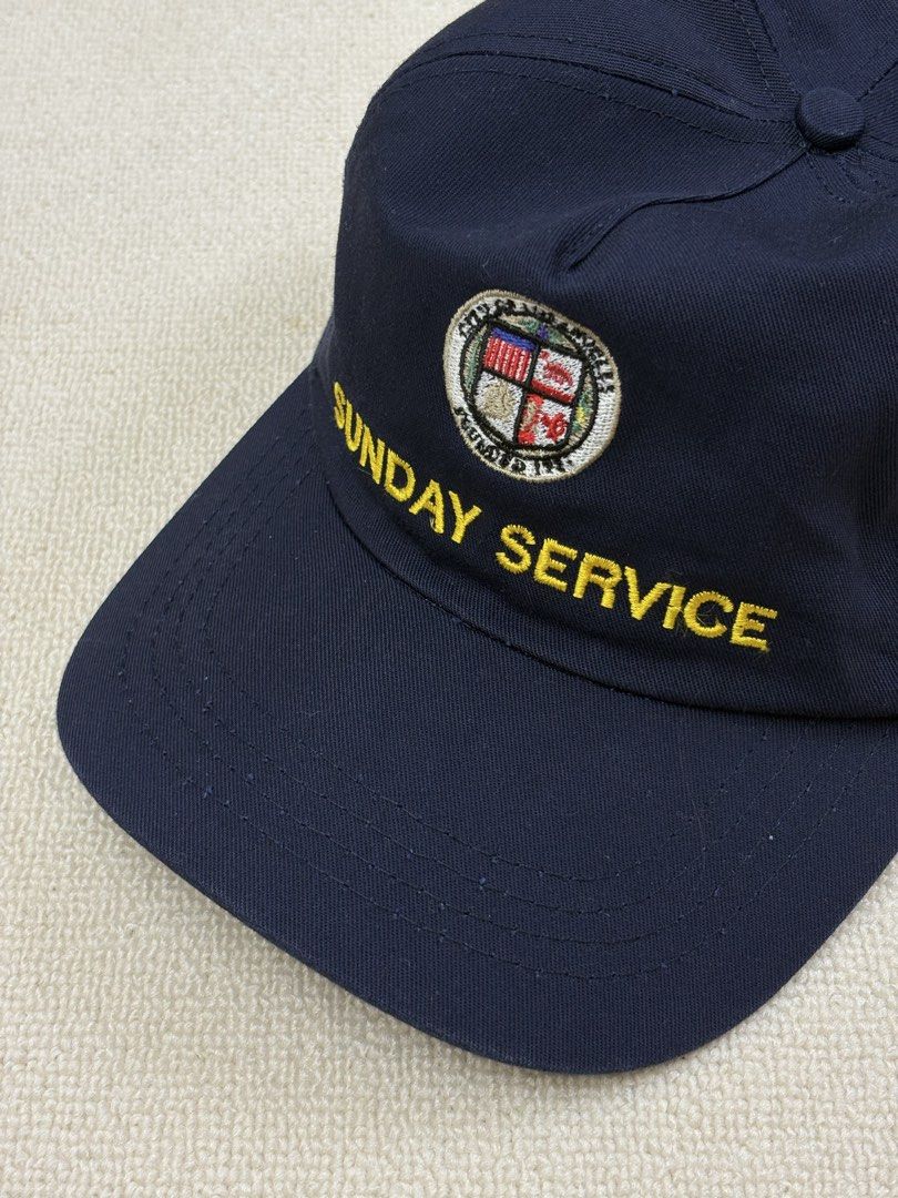 Kanye West sunday service hat (Category: Caps & Hats) located in Manila. Submitted by porma.market (Listing ID 1461577759, Image 1). Description: - Navy blue baseball cap - Features 'SUNDAY SERVICE' embroidered in yellow on the front - Includes a circular logo above the text - 'MADE IN USA' tag inside - Simple and classic design.