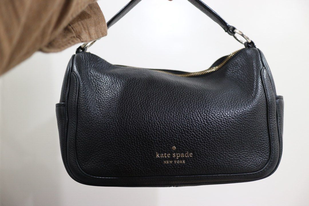 Kate Spade Black Leather Smoosh Crossbody Bag (Category: Cross-body Bags) located in Quezon City. Submitted by juvyjuvydoo (Listing ID 1461728126, Image 2). Description: - Authentic Kate Spade crossbody bag - Color: Black - Material: Pebbled leather - Closure: Zip top - Features: Side pockets, adjustable strap - Ideal for: Everyday wear.