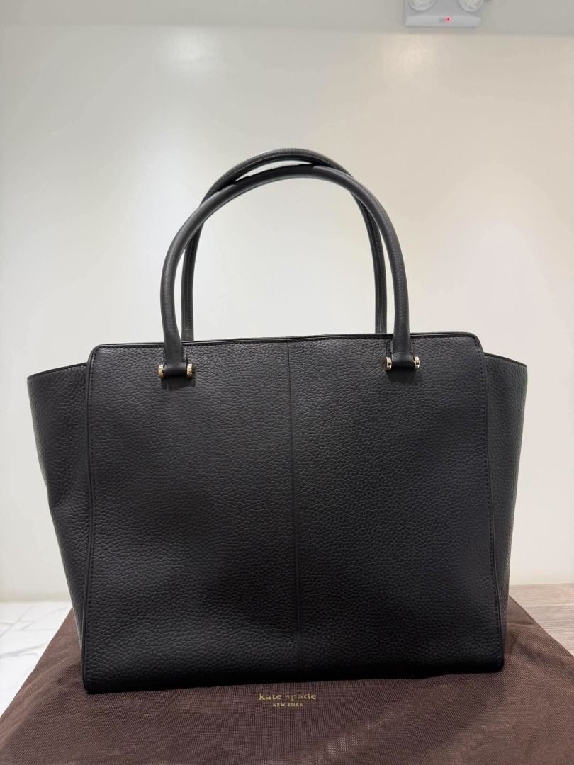 Kate Spade Black Leather Tote Bag (Category: Tote Bags) located in Caloocan City. Submitted by purefalcon.974eee (Listing ID 1461607035, Image 2). Description: - Classic black leather tote from Kate Spade New York - Pebbled leather finish - Front zip pocket with tassel detail - Multiple interior compartments and a zip pocket - Gold hardware - Comes with dust bag - Ideal for everyday use 100% Authentic .