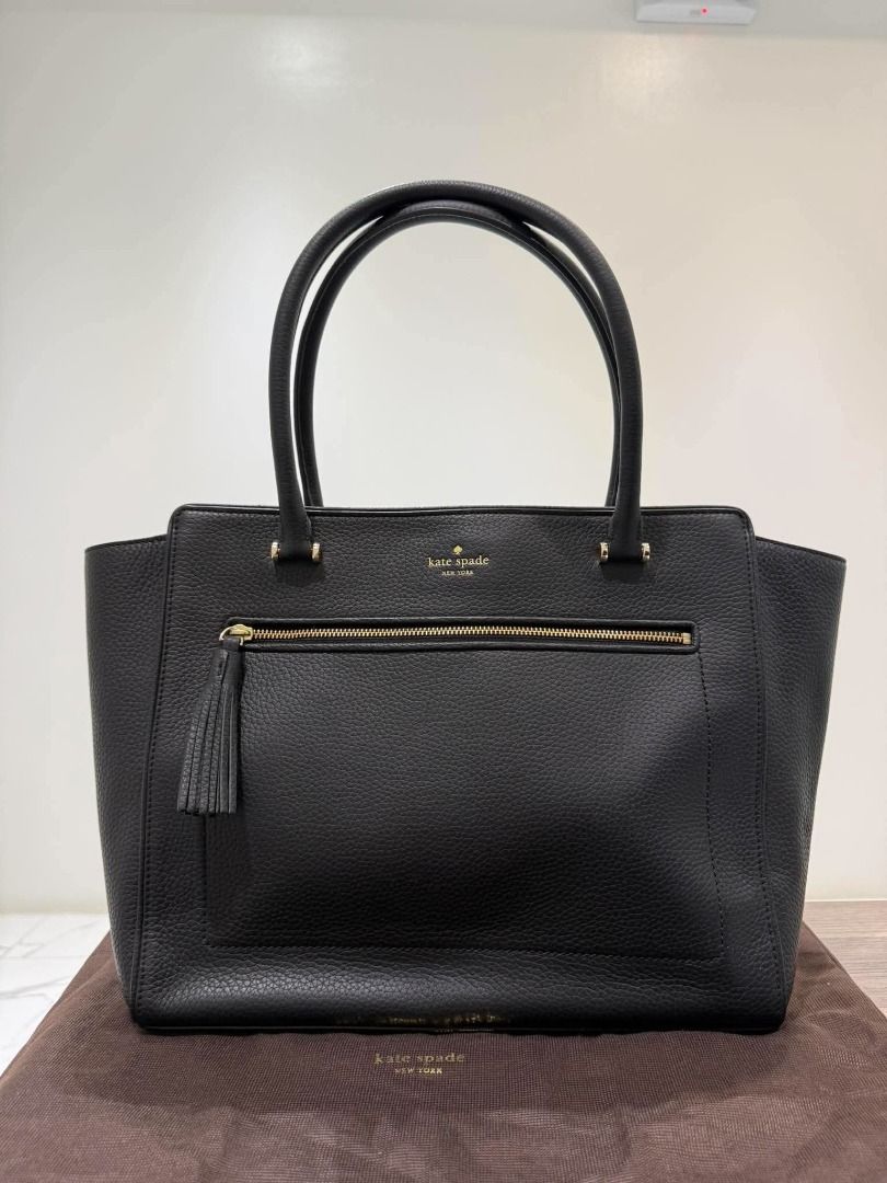 Kate Spade Black Leather Tote Bag (Category: Tote Bags) located in Caloocan City. Submitted by purefalcon.974eee (Listing ID 1461607035, Image 1). Description: - Classic black leather tote from Kate Spade New York - Pebbled leather finish - Front zip pocket with tassel detail - Multiple interior compartments and a zip pocket - Gold hardware - Comes with dust bag - Ideal for everyday use 100% Authentic .