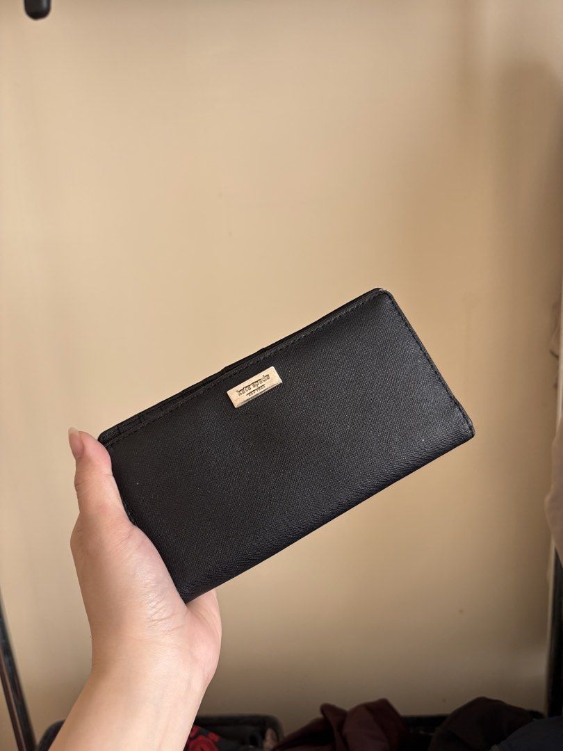 Kate Spade Black Wallet (Category: Wallets & Card holders) located in Dasmarinas. Submitted by aubreyanabee (Listing ID 1461717619, Image 2). Description: - Authentic Kate Spade wallet - Color: Black - Material: Saffiano leather - Features: Multiple card slots, clear ID window - Closure: Snap closure .