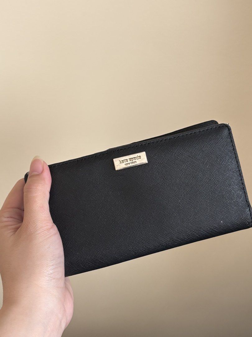 Kate Spade Black Wallet (Category: Wallets & Card holders) located in Dasmarinas. Submitted by aubreyanabee (Listing ID 1461717619, Image 1). Description: - Authentic Kate Spade wallet - Color: Black - Material: Saffiano leather - Features: Multiple card slots, clear ID window - Closure: Snap closure .
