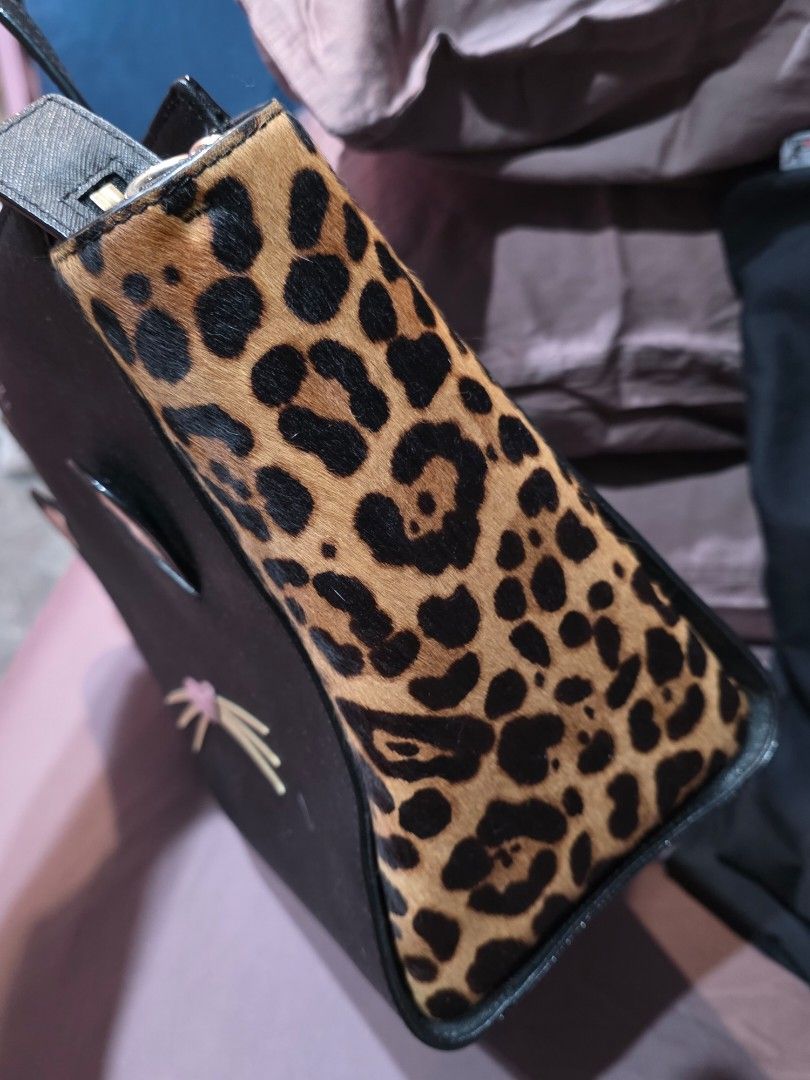 Kate Spade Hayden Set (Category: Luxury Bags & Wallets) located in Taguig. Submitted by lovedbymicah (Listing ID 1461645024, Image 3). Description: - Brand: Kate Spade - Model: Hayden Set (Mama & Baby) - Color: Black with leopard print accents - Design: Cute cat face with ears and whiskers - Material: Saffiano leather - Includes: Two bags (larger Mama Hayden and smaller Baby Hayden both w long strap) - Unique Feature: Playful and charming cat-the