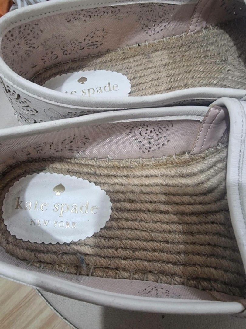 Kate Spade New York White Laser Cut Espadrilles (Category: Flats & Sandals) located in Calasiao. Submitted by pj_ulanday051184 (Listing ID 1461687341, Image 2). Description: - Brand: Kate Spade New York - Color: White - Style: Espadrilles - Size: 8.5B - Design: All-over laser-cut floral pattern - Sole: Jute detail - Closure: Easy slip-on - Occasion: Great for casual wear.