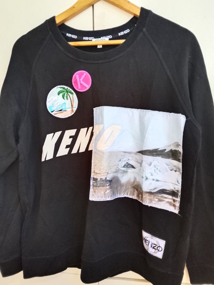 Kenzo Black Sweatshirt Size L (Category: Coats, Jackets and Outerwear) located in Bogo. Submitted by algarme2018 (Listing ID 1461623222, Image 2). Description: - Brand: Kenzo - Item: Sweatshirt - Color: Black - Features: Graphic patches, KENZO logo - Size: L - Origin: Made in Portugal - Occasion: Casual wear.