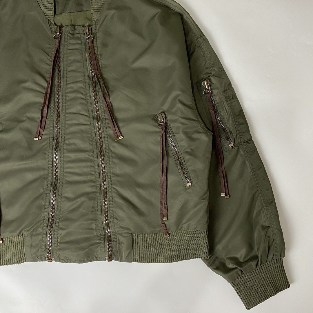 Kenzo Elevated Military Bomber Jacket (Category: Coats, Jackets and Outerwear) located in Bacolod City. Submitted by rewear.conceptual (Listing ID 1461606657, Image 2). Description: Kenzo Elevated Military Bomber Jacket Condition: 9/10 Color rate: 9.5/10 Tagged as: large Width: 22 Length: 22 Shoulder:22 Sleeves: 20.5 Message seller if interested Always double check the items description before making an offer. Strictly no return/refund policy! .