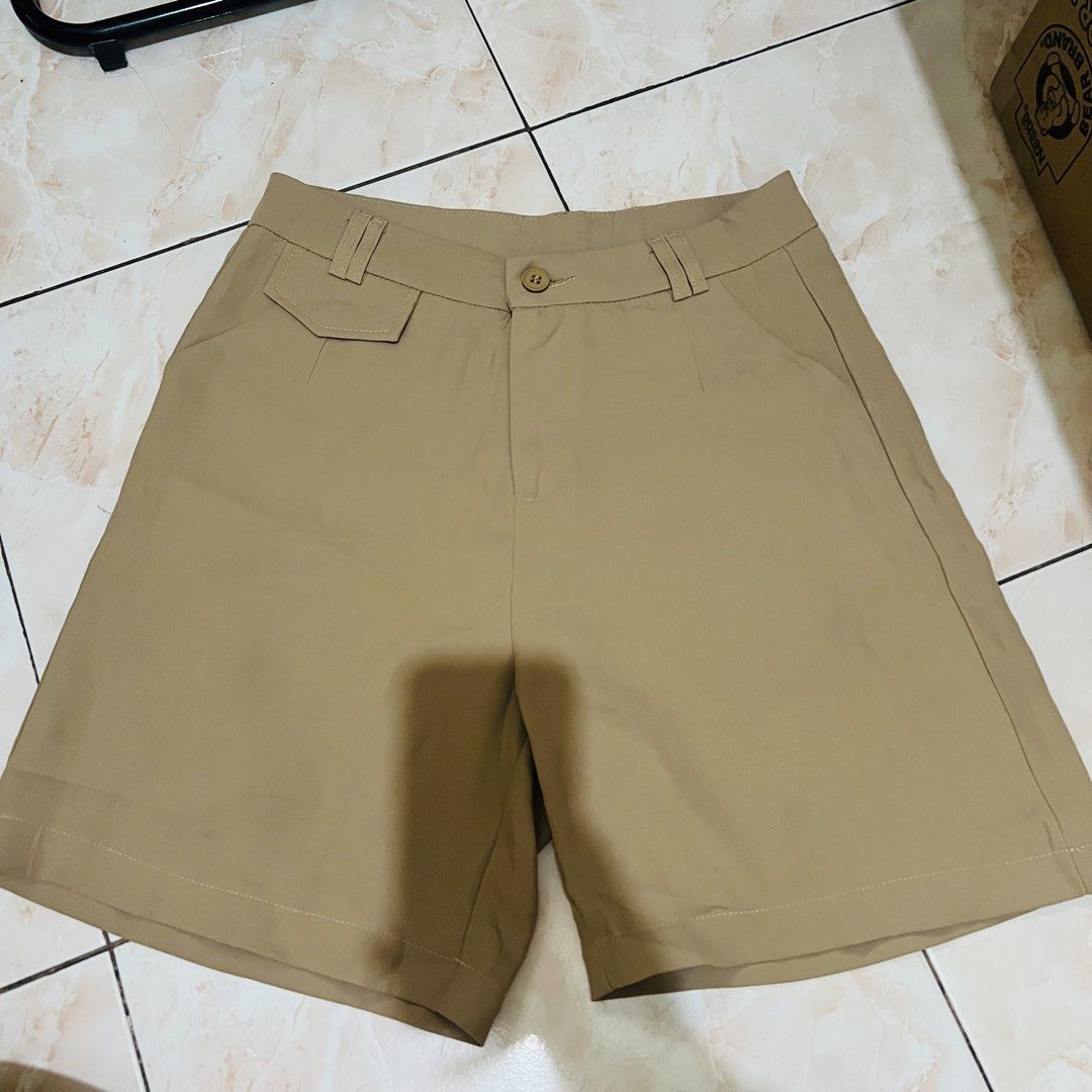 Khaki Tailored Shorts (Category: Shorts) located in Marikina City. Submitted by kzells13 (Listing ID 1461579057, Image 2). Description: - Tailored fit khaki shorts - Button and zip closure - Two side pockets - Small flap pocket on left hip - Sturdy cotton blend fabric - Versatile for casual and smart-casual outfits.