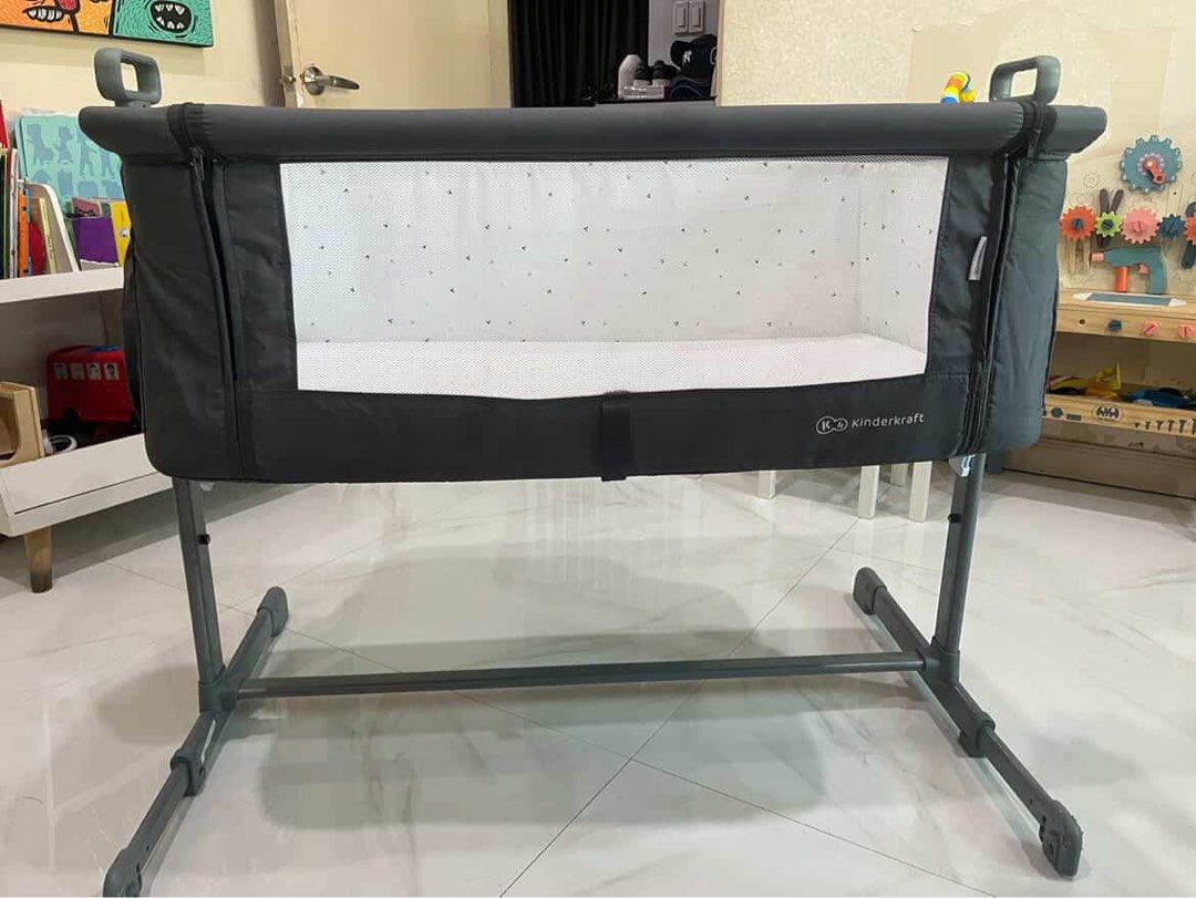 Kinderkraft co-sleeping crib (Category: Children's Beds) located in Alfonso. Submitted by happymom2026 (Listing ID 1461735122, Image 1). Description: Kinderkraft co-sleeping crib. Height is adjustable Slight issue on the metal /plastic part of the leg. Scratch marks / dog bite..