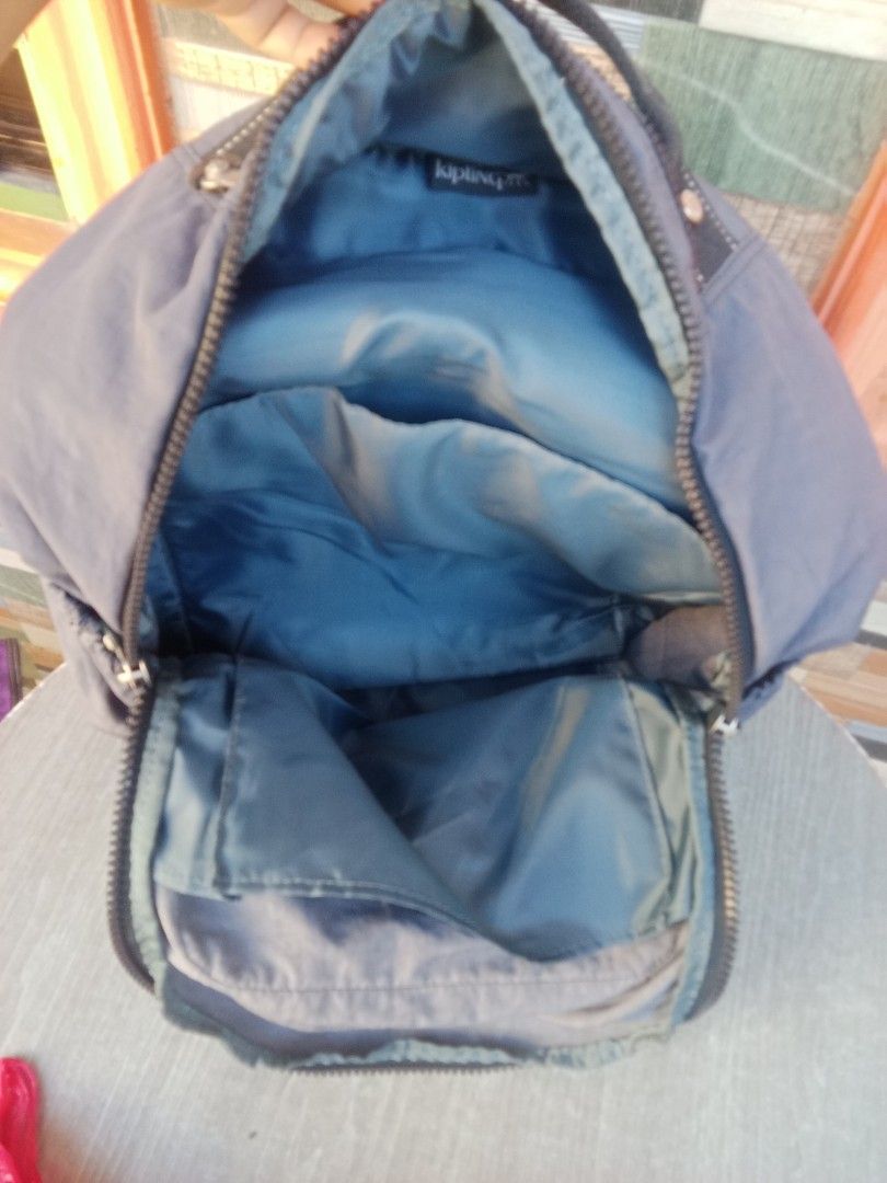 Kipling Backpack Grey Nylon (Category: Backpacks) located in Bacoor. Submitted by aileen678s75866 (Listing ID 1461796709, Image 2). Description: - Grey Kipling backpack - Spacious interior - Front zip pocket - Side pockets for water bottles - Adjustable straps - Durable nylon material - Ideal for school or travel.