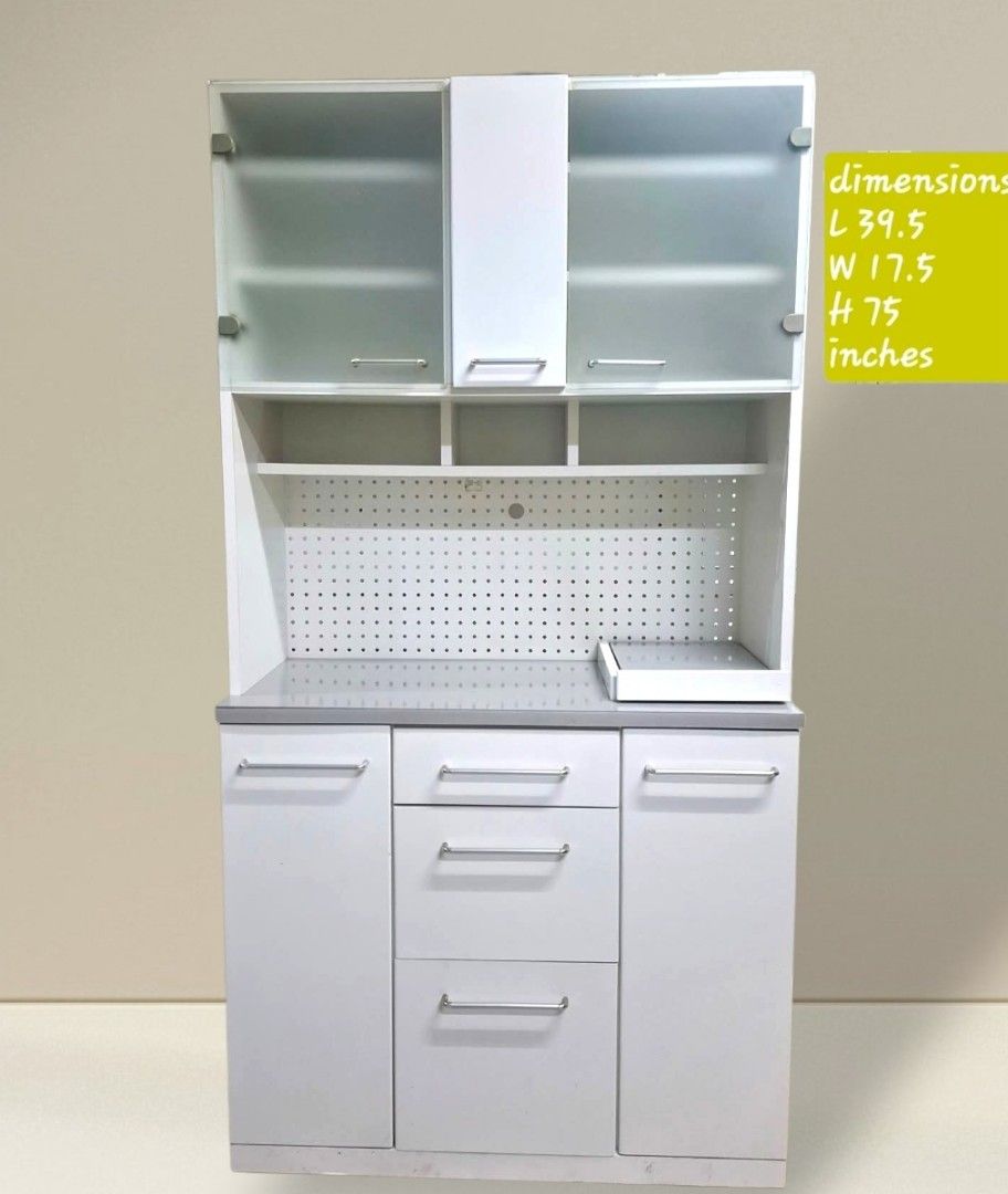 Kitchen Cupboard Hutch Cabinet (Category: Shelves, Cabinets & Racks) located in Quezon City. Submitted by dannikkishoppe2 (Listing ID 1461570383, Image 1). Description: Kitchen Cupboard Hutch Cabinet ‼️₱11000‼️ • Top section features glass doors and shelving • Bottom section includes drawers and cabinet space • Integrated pegboard backing for convenient utensil organization • Ideal for kitchens or office clinic Please manage your expectations as 