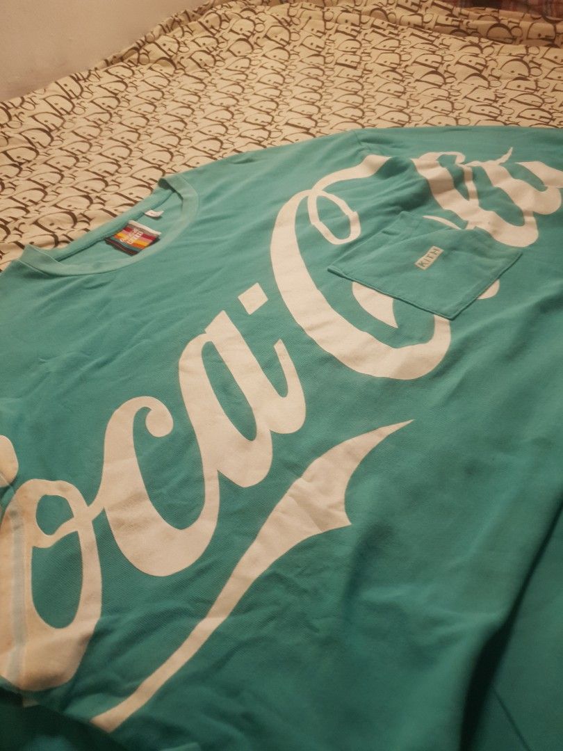 Kith x Coca cola big logo (Category: Coats, Jackets and Outerwear) located in San Fernando. Submitted by retro.district. (Listing ID 1461778176, Image 2). Description: - kith x Coca cola big logo - Size: 2XL - 3XL (26x32) - Condition: Excellent - no issue - Color Rate: 9.5/10.