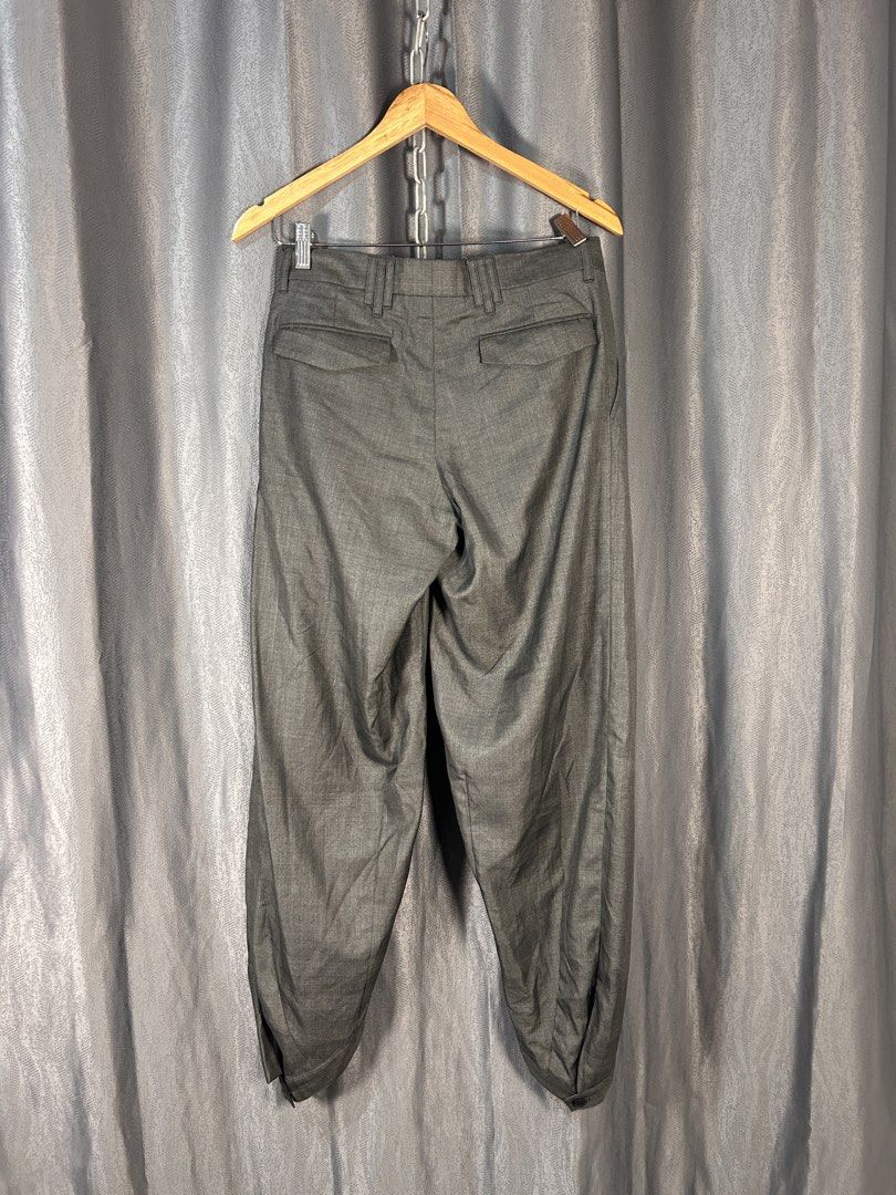 KRIS VAN ASSCHE PLEATED TROUSER (Category: Trousers) located in General Mariano Alvarez. Submitted by manosegunda4117 (Listing ID 1460543286, Image 3). Description: KRIS VAN ASSCHE PLEATED TROUSER Size 38 Measurements : Waistline - 30 in Length - 40 approx Features detailed belt loops and hem buttons Price : PHP 1,500 + shipping fee .
