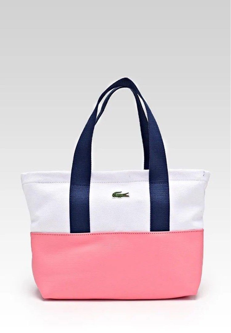 Lacoste Canvas Tote Bag Pink White Navy (Category: Tote Bags) located in Las Pinas. Submitted by yourboki.2026 (Listing ID 1461605977, Image 1). Description: ❌MISSING Small Pouch (actual photo with complete inclusion will be on the last photo) 💯ORIGINAL LACOSTE - Cute Lacoste tote bag - White canvas with pink bottom - Navy blue handles - Inner zip pocket - Great for everyday use - Shows some signs of wear on white canvas - Still has plenty of li