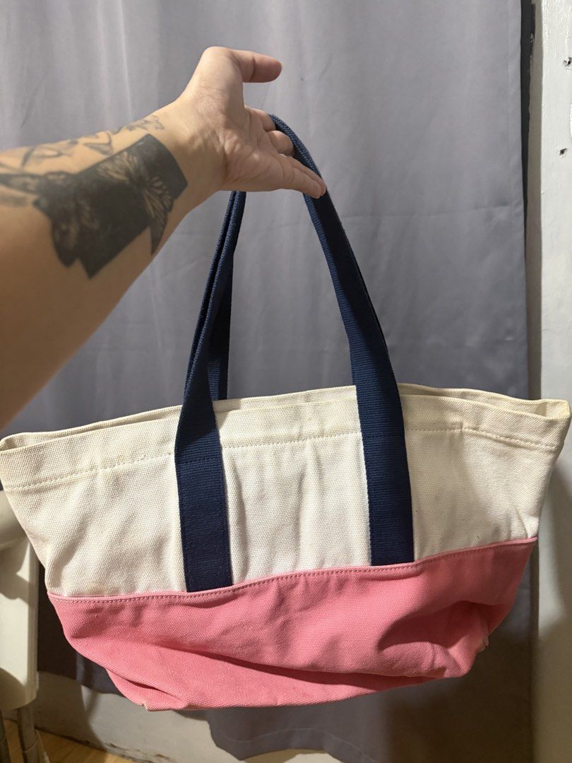 Lacoste Canvas Tote Bag Pink White Navy (Category: Tote Bags) located in Las Pinas. Submitted by yourboki.2026 (Listing ID 1461605977, Image 3). Description: ❌MISSING Small Pouch (actual photo with complete inclusion will be on the last photo) 💯ORIGINAL LACOSTE - Cute Lacoste tote bag - White canvas with pink bottom - Navy blue handles - Inner zip pocket - Great for everyday use - Shows some signs of wear on white canvas - Still has plenty of li