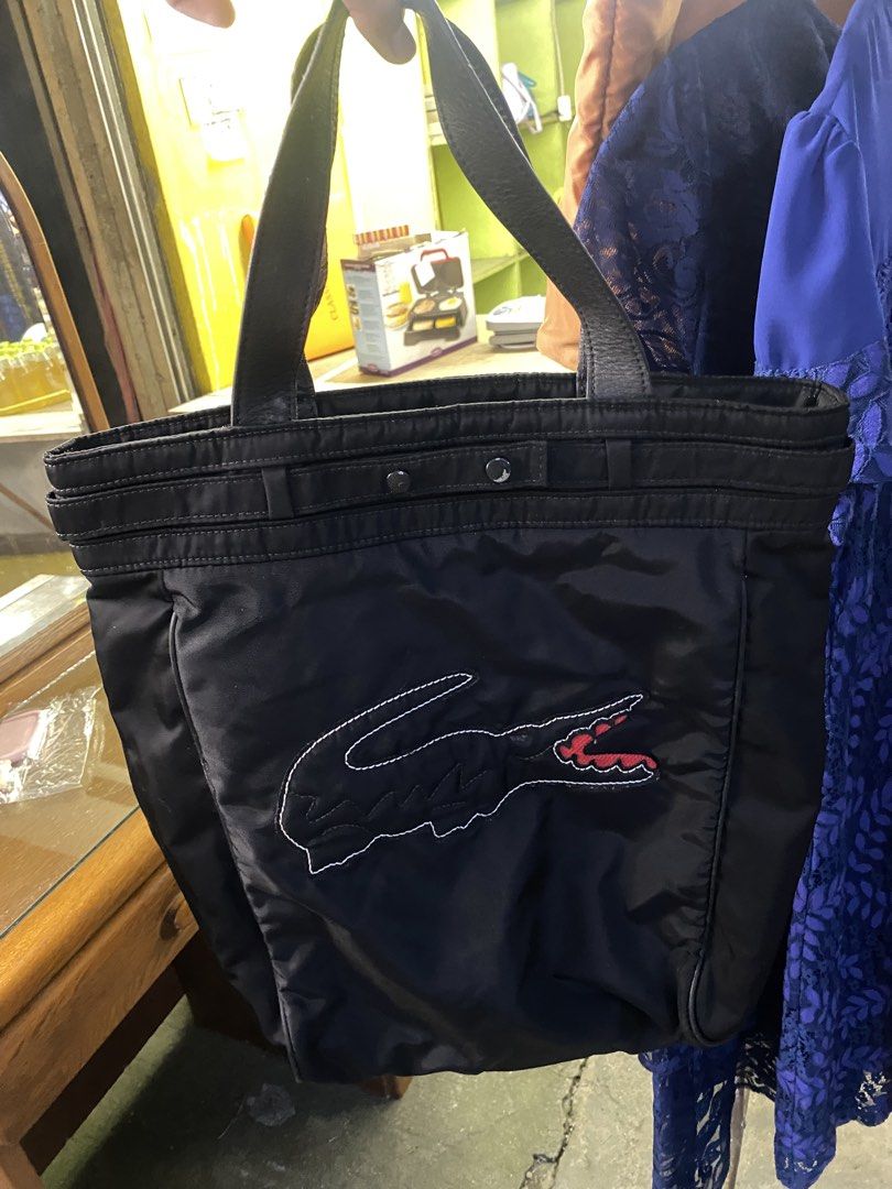 Lacoste hand bag (Category: Announcements) located in Manila. Submitted by thrifttodays. (Listing ID 1461595793, Image 1). Description: Lacoste hand bag Good condition Pwede lagayan ng loptop Medyo malaki den .