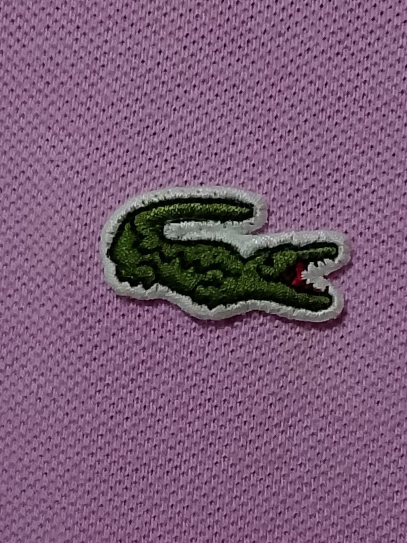 Lacoste Polo Shirt - Purple (Category: Tshirts & Polo Shirts ) located in San Pedro. Submitted by jokwanrocks09 (Listing ID 1461672771, Image 2). Description: Selling a classic Lacoste polo shirt. It's a lovely shade of purple. Features the iconic crocodile logo embroidered on the chest. Made in Peru, designed in France. Great for casual wear or a smart-casual look. Check the photos for details. 19x26 medium .