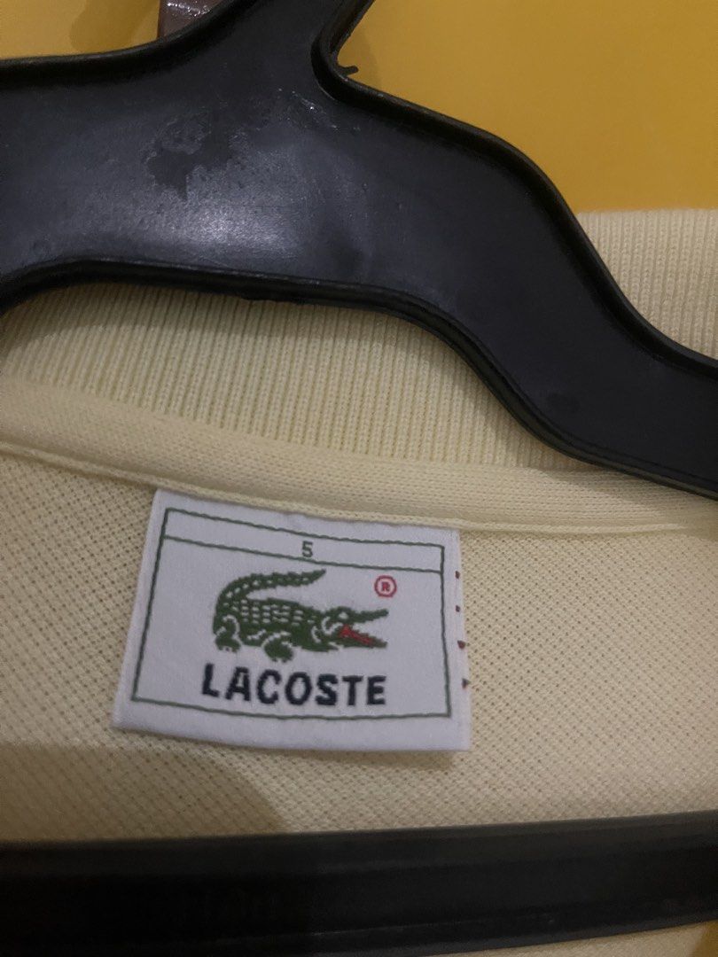 Lacoste Polo Shirt Yellow Size 5 (Category: Tshirts & Polo Shirts ) located in Manila. Submitted by brahma806 (Listing ID 1461718706, Image 2). Description: Classic yellow Lacoste polo shirt, size 5. Features the iconic crocodile logo. Perfect for everyday casual wear. 21.5x 29.