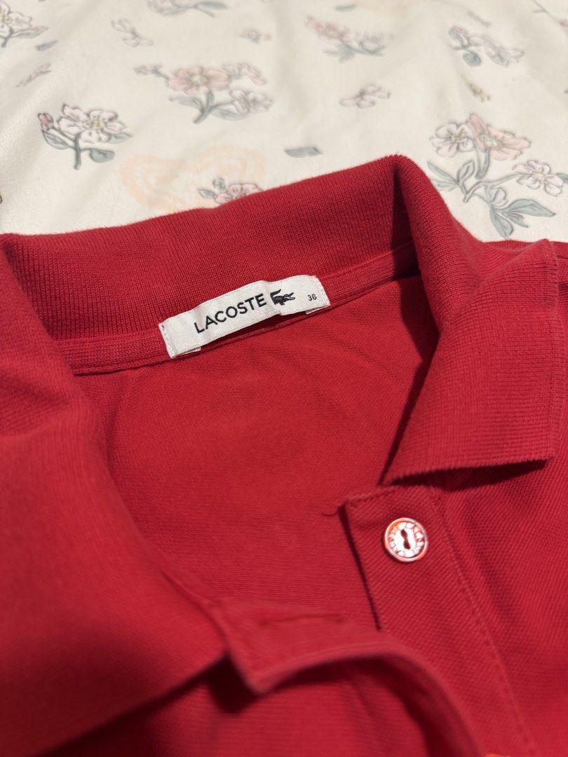 Lacoste Red Polo Shirt Size 36 (Category: Tshirts & Polo Shirts ) located in Manila. Submitted by chloemhoretz (Listing ID 1461686935, Image 2). Description: - Classic red Lacoste polo shirt - Iconic crocodile logo on chest - Button-up neckline - Comfortable cotton and elastane blend - Size 36 xs to semi med - Ideal for casual or sporty wear.
