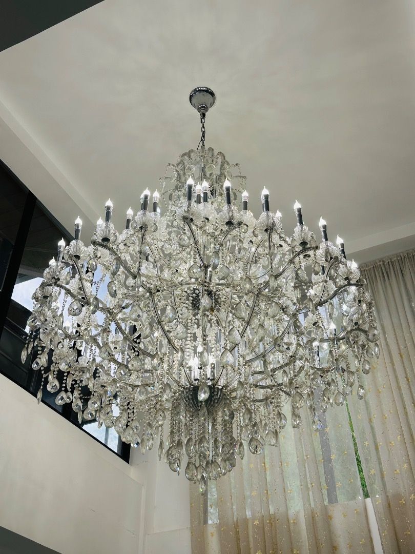 Large Crystal Chandelier with Multiple Tiers. (Category: Lighting) located in Davao. Submitted by emmabasoc (Listing ID 1461582454, Image 1). Description: - Beautiful multi-tiered crystal chandelier - Offers lots of sparkle and shine - Perfect for grand entrances or dining rooms - Adds a touch of luxury to any space - All crystals are intact - Ready for installation.