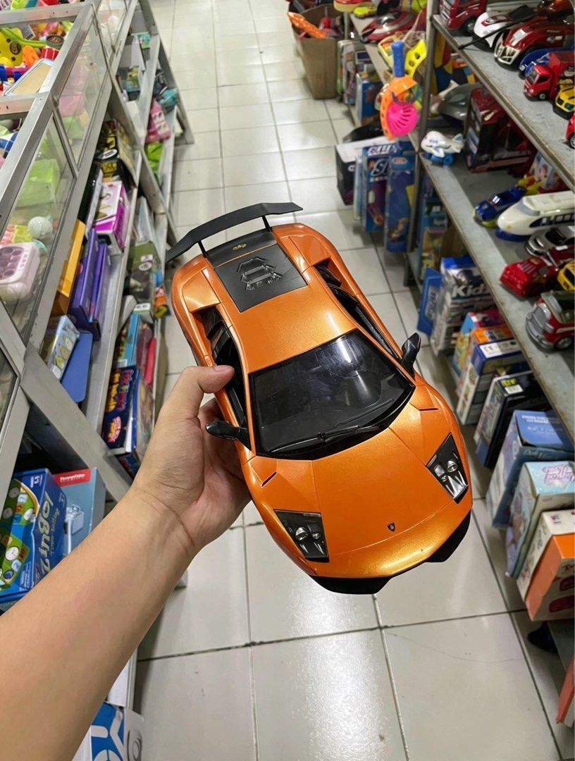 Large Lamborghini Murciélago SV RC Model (Category: Vehicle & Diecast Models) located in Manila. Submitted by maki.findzzz (Listing ID 1461671355, Image 3). Description: 📍 MEETUP / PICKUP: • Quezon City, NCR — can arrange meetups around QC area • Can also ship via Lalamove / Grab / J&T at buyer’s expense 📦 Model: Lamborghini Murciélago LP 670-4 SuperVeloce (SV) — Licensed replica • Scale: Large ~1:10 size — big & impressive display piece! • Col