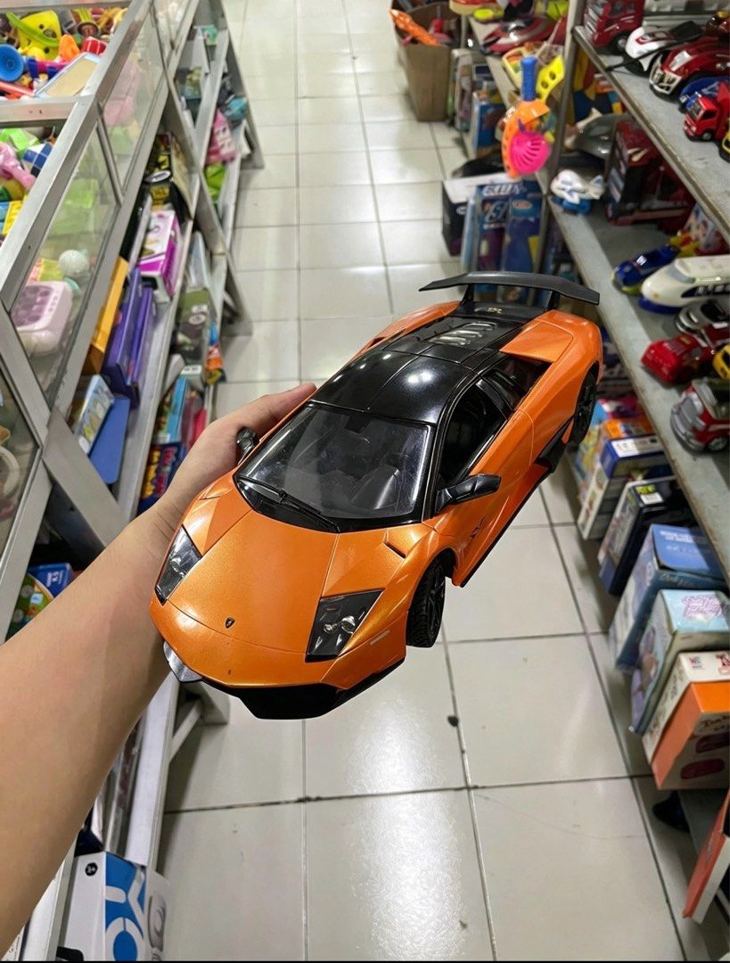 Large Lamborghini Murciélago SV RC Model (Category: Vehicle & Diecast Models) located in Manila. Submitted by maki.findzzz (Listing ID 1461671355, Image 1). Description: 📍 MEETUP / PICKUP: • Quezon City, NCR — can arrange meetups around QC area • Can also ship via Lalamove / Grab / J&T at buyer’s expense 📦 Model: Lamborghini Murciélago LP 670-4 SuperVeloce (SV) — Licensed replica • Scale: Large ~1:10 size — big & impressive display piece! • Col