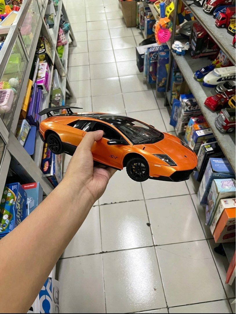 Large Lamborghini Murciélago SV RC Model (Category: Vehicle & Diecast Models) located in Manila. Submitted by maki.findzzz (Listing ID 1461671355, Image 2). Description: 📍 MEETUP / PICKUP: • Quezon City, NCR — can arrange meetups around QC area • Can also ship via Lalamove / Grab / J&T at buyer’s expense 📦 Model: Lamborghini Murciélago LP 670-4 SuperVeloce (SV) — Licensed replica • Scale: Large ~1:10 size — big & impressive display piece! • Col
