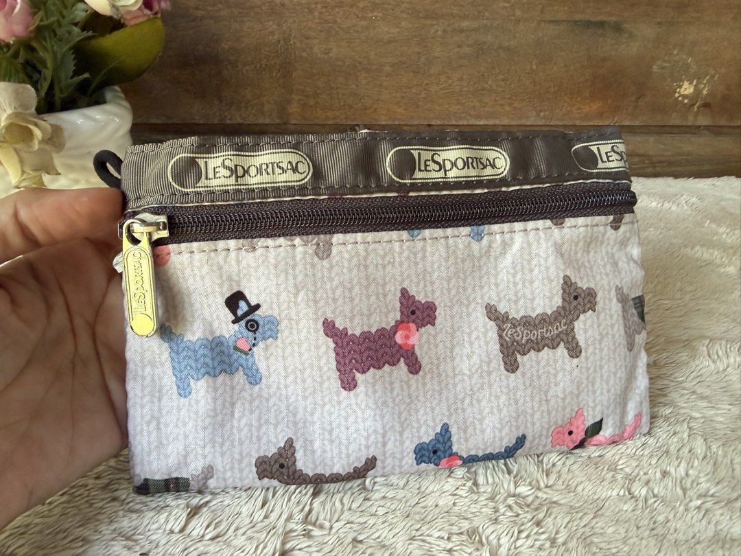 LeSportsac Pouch (Category: Purses & Pouches) located in Tarlac. Submitted by alta.mayo (Listing ID 1461774653, Image 1). Description: • 7 x 4.5 inches • nylon Guaranteed 💯% Authentic ❎ No Reservation 📌 Mop: Gcash 📌 Courier: JNT 📌 Location: Tarlac.