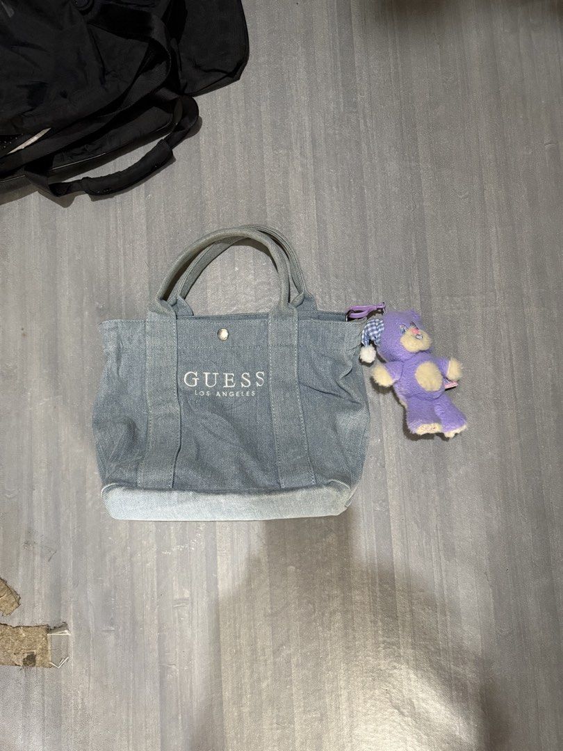 Light wash denim Guess tote bag (Category: Tote Bags) located in Cagayan de Oro. Submitted by twice.but.nice.blackmarket (Listing ID 1461639290, Image 1). Description: Excellent condition Height 10 Width 13.