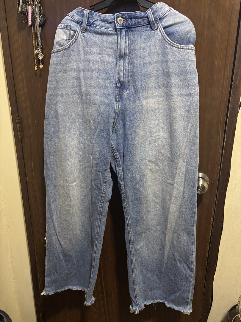 Light Wash Wide Leg Jeans with Frayed Hem (Category: Jeans) located in Makati City. Submitted by margauux_ (Listing ID 1461663240, Image 2). Description: - Light wash denim - Wide leg cut - Frayed hem detail - Classic five-pocket styling - Button and zip closure - Comfortable and stylish for everyday wear - Size 35, can fit up to 38.