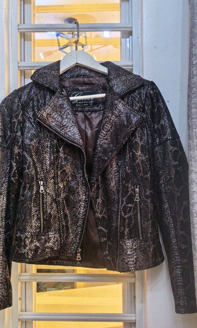 Like new Guess snake like Jacket petite (Category: Coats, Jackets and Outerwear) located in Tuguegarao City. Submitted by zenphoenix-7ad615 (Listing ID 1461604306, Image 2). Description: Like new Snake skinlike style Guess For petite to small frame Shoulder to shoulder 15 inches 21 inches length.