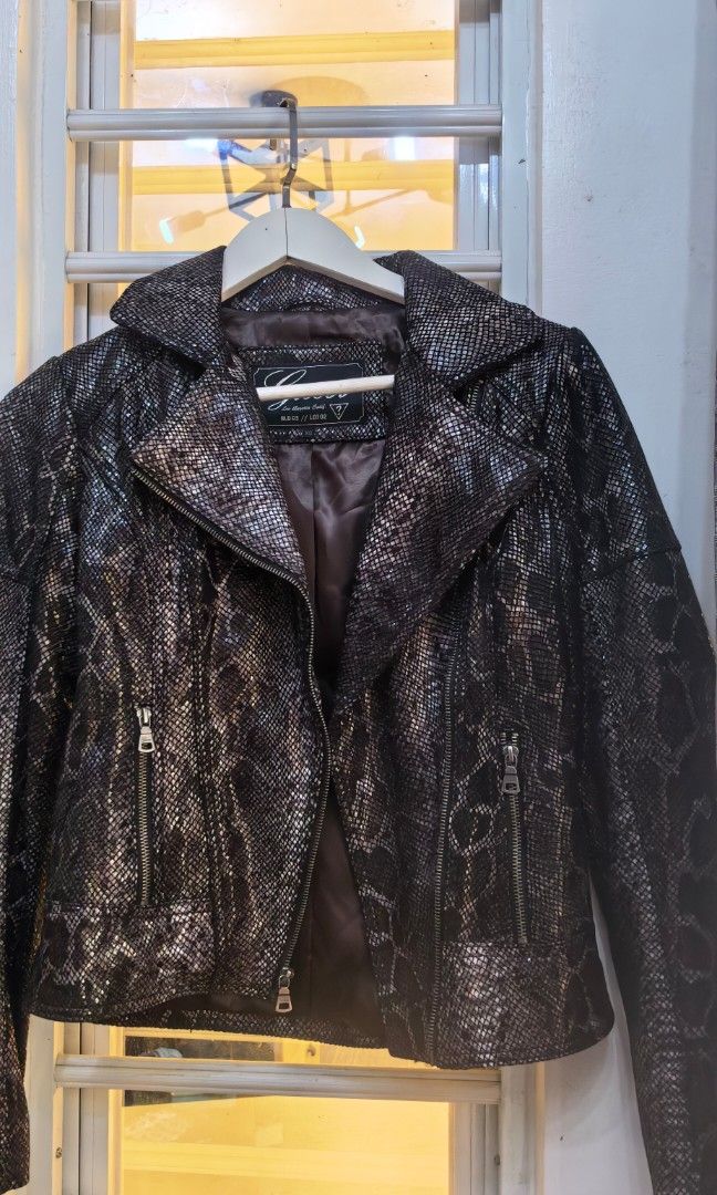 Like new Guess snake like Jacket petite (Category: Coats, Jackets and Outerwear) located in Tuguegarao City. Submitted by zenphoenix-7ad615 (Listing ID 1461604306, Image 1). Description: Like new Snake skinlike style Guess For petite to small frame Shoulder to shoulder 15 inches 21 inches length.
