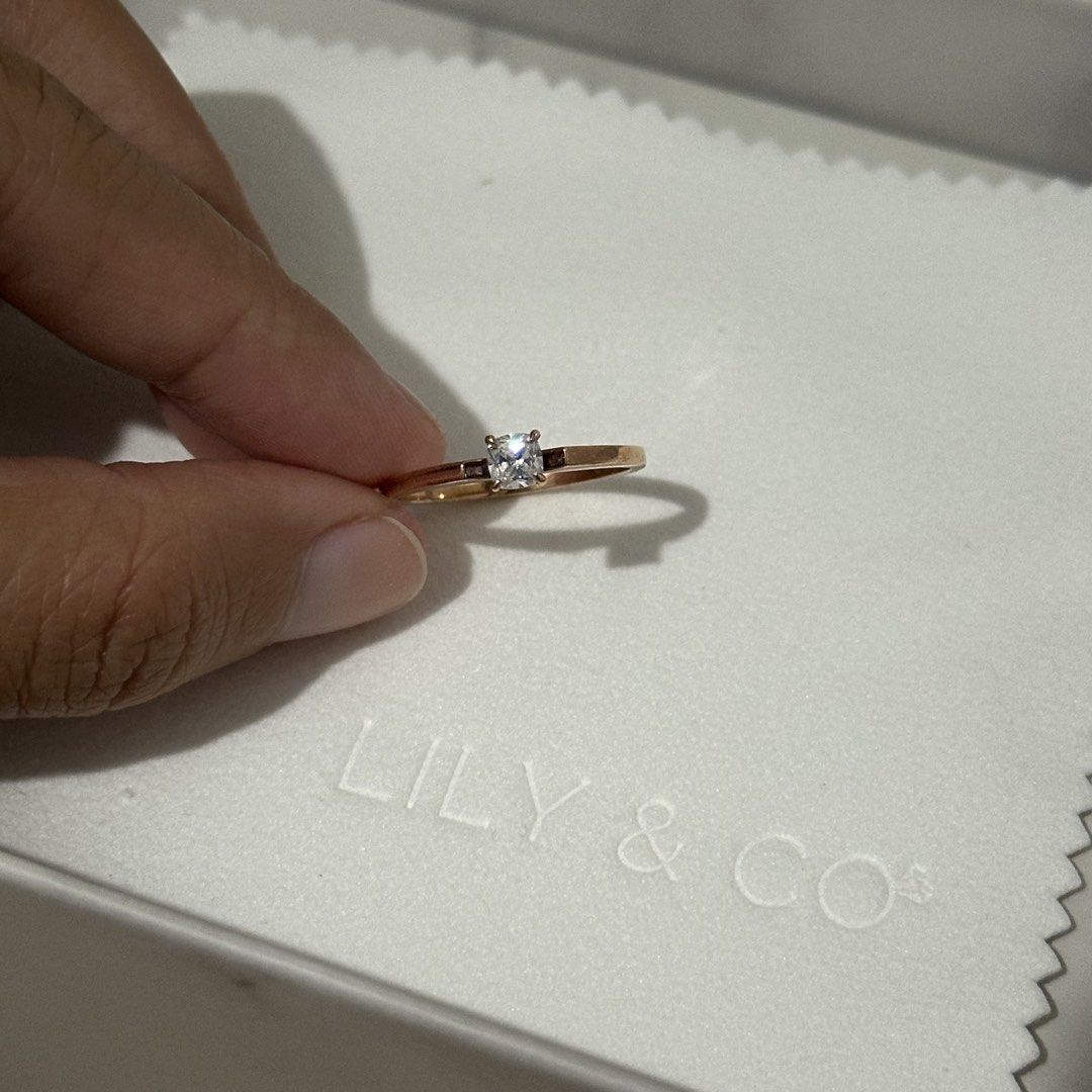 LILY AND CO AYA ENGAGEMENT RING (Category: Rings) located in Mandaluyong City. Submitted by alyrem (Listing ID 1461685211, Image 3). Description: SELLING LILY & CO AYA RING (ENGAGEMENT) 14K ROSE GOLD .30 ct - CUSHION CUT 4 PRONGS SIGNITY STONE SIZE - 8.25 ₱26K RFS-WRONG SIZE.
