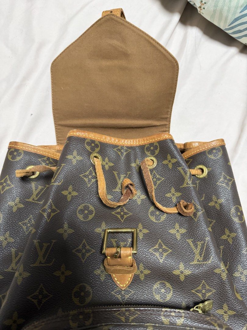 Louis Vuitton Backpack with dust bag (Category: Luxury Bags & Wallets) located in Angeles City. Submitted by lecsdeclutter (Listing ID 1461723365, Image 2). Description: Price negotiable Thrifted from Qatar (orig price: ₱50000) Condition: got stuck inside wardrobe Exterior: Actual bag leather (with LV logo) is in good condition Leather drawstring & straps are peeling/old Large size Bottom leather part is discolored Zippers & stitches are all in g