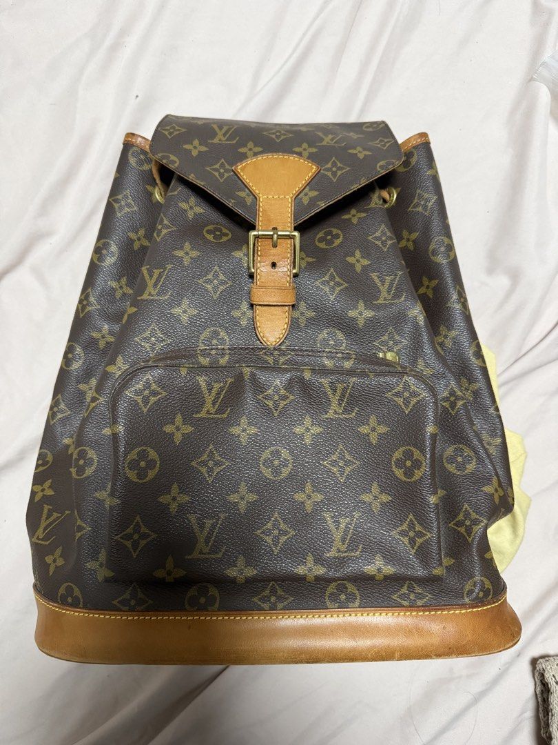 Louis Vuitton Backpack with dust bag (Category: Luxury Bags & Wallets) located in Angeles City. Submitted by lecsdeclutter (Listing ID 1461723365, Image 1). Description: Price negotiable Thrifted from Qatar (orig price: ₱50000) Condition: got stuck inside wardrobe Exterior: Actual bag leather (with LV logo) is in good condition Leather drawstring & straps are peeling/old Large size Bottom leather part is discolored Zippers & stitches are all in g