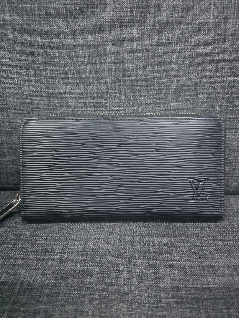 Louis Vuitton Epi Leather Long Wallet (Category: Wallets & Card holders) located in General Trias. Submitted by roselle2230 (Listing ID 1461689750, Image 1). Description: - Authentic Louis Vuitton Long Wallet - Material: Black Epi Leather - Hardware: Silver - Closure: Zip Around - Features: Ample space for cards and cash - Condition: Overall good, with some signs of wear on the zipper pull - Ideal for: Everyday use.