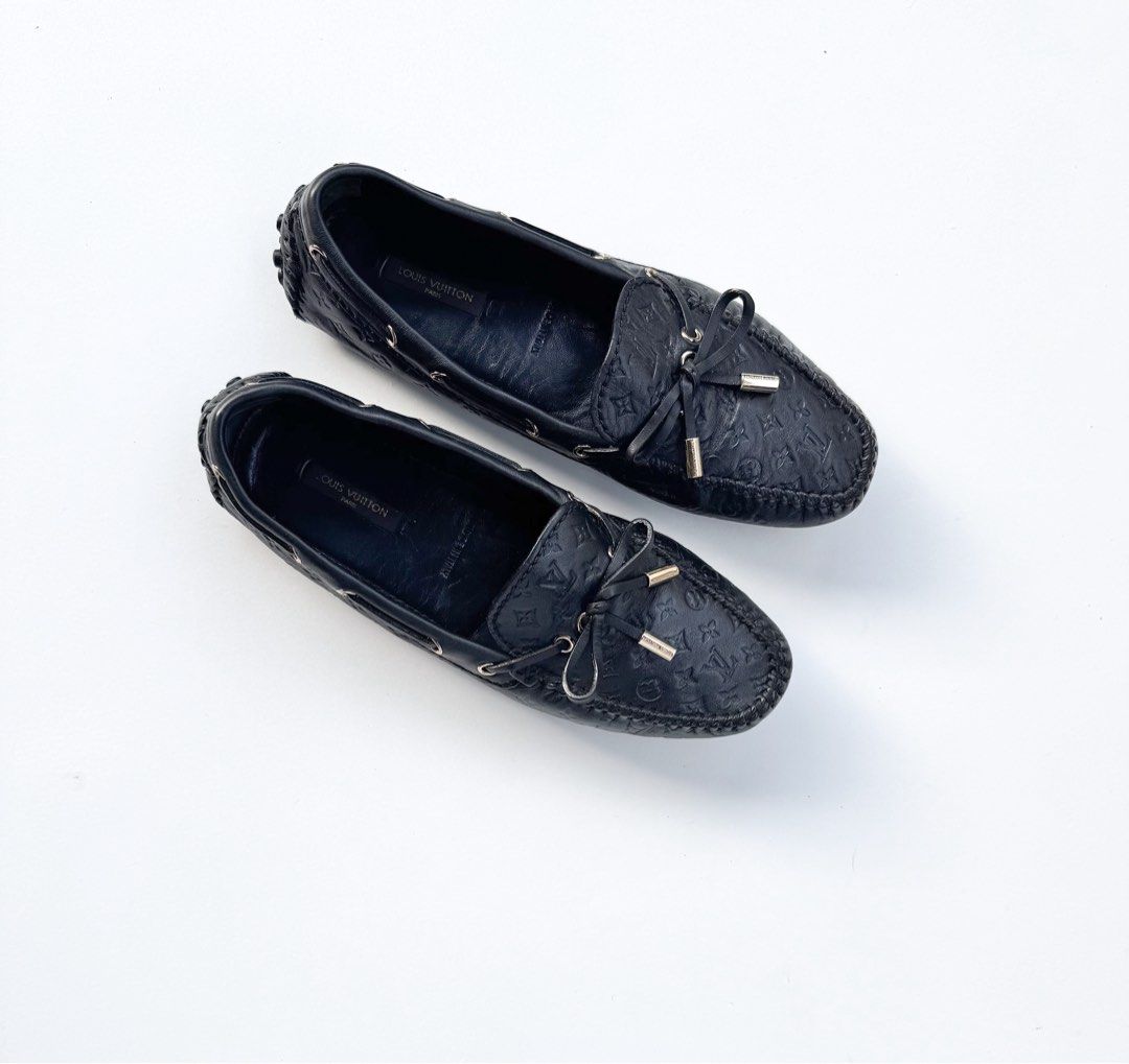 Louis Vuitton Gloria Monogram Leather Loafers (Category: Loafers) located in Davao. Submitted by LUXURY (Listing ID 1461654559, Image 1). Description: Louis Vuitton Gloria monogram loafers in black. Embossed leather with a silver hardware bow. Classic slip-on, versatile for any outfit..