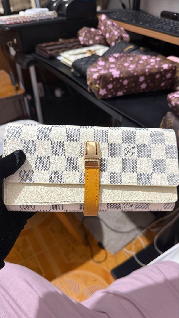 Louis Vuitton Long Wallet (Category: Luxury Bags & Wallets) located in Makati City. Submitted by shopchaze (Listing ID 1461692891, Image 1). Description: ✨ Details: * Louis Vuitton * White/Grey Damier pattern * Comes with original box * Comes with authenticity card * Good condition * Classic and elegant design * Perfect for everyday use or special occasions 📦 Inclusions: Bag + Box + Authenticity Card 💸 MODE OF PAYMENT * BPI * MariBank * GCash *