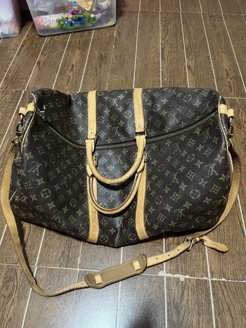 Louis Vuitton Monogram Keepall 55 Duffle Bag (Category: Luxury Bags & Wallets) located in Victorias. Submitted by lan1877 (Listing ID 1461593077, Image 1). Description: - Classic Louis Vuitton Keepall 55 - Monogram canvas with vachetta leather trim - Spacious, ideal for travel - Secure zipper closure - Includes detachable shoulder strap - Date code visible.