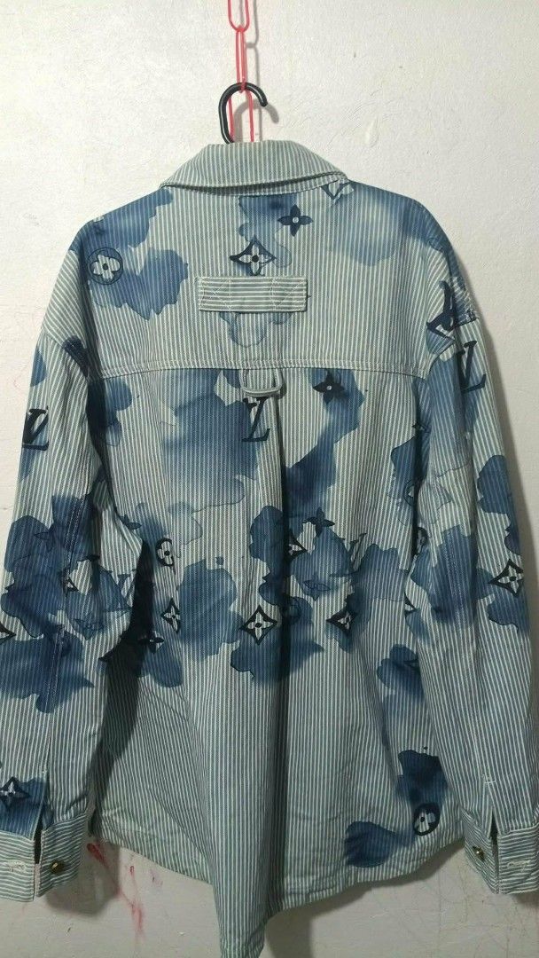 Louis Vuitton Striped Denim Jacket with Monogram Print (Category: Luxury Apparel) located in San Fernando. Submitted by anal.cris (Listing ID 1461575717, Image 2). Description: - Iconic LV monogram denim jacket - Stylish blue and white stripe pattern - Classic button-up front with chest pockets - Gold buttons featuring the LV logo - A definite head-turner and wardrobe essential.