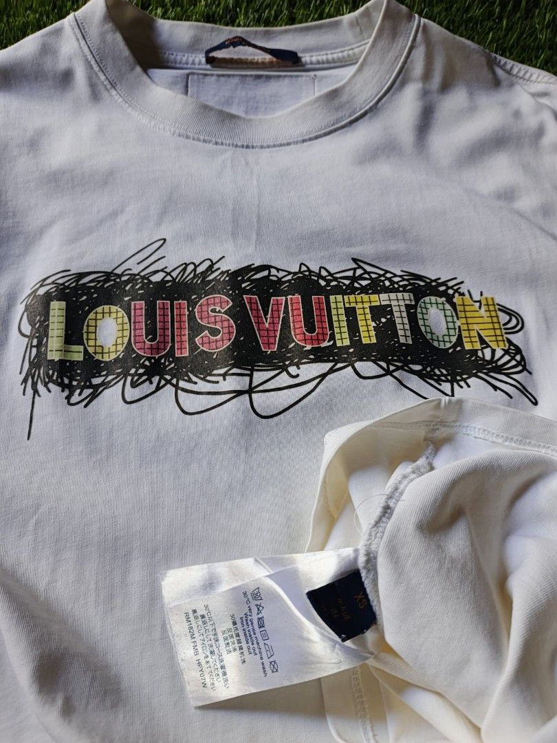 Louis Vuitton T-shirt (Category: Tshirts & Polo Shirts ) located in Dipolog. Submitted by vinzz_thrift (Listing ID 1461690837, Image 3). Description: - Authentic Louis Vuitton t-shirt - Color: White - Design: LV logo with colorful scribble - Size: XS - Ideal for casual outings.