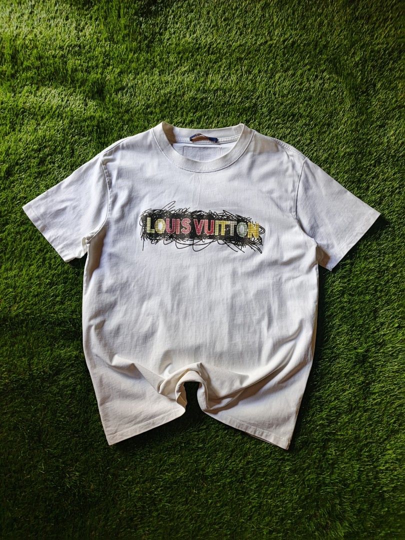 Louis Vuitton T-shirt (Category: Tshirts & Polo Shirts ) located in Dipolog. Submitted by vinzz_thrift (Listing ID 1461690837, Image 1). Description: - Authentic Louis Vuitton t-shirt - Color: White - Design: LV logo with colorful scribble - Size: XS - Ideal for casual outings.