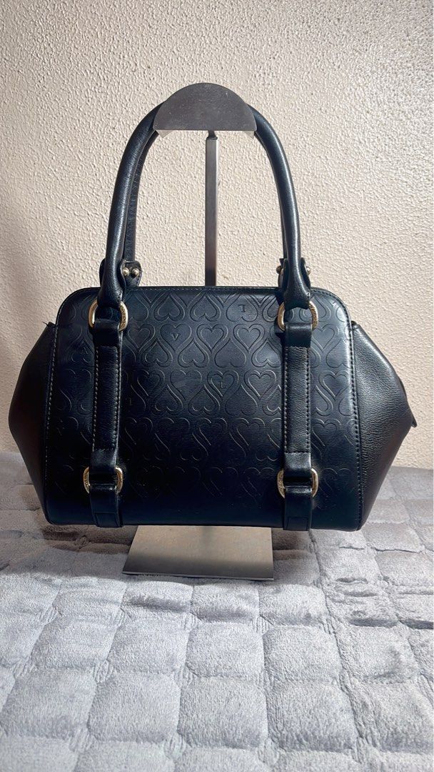 LOVCAT Paris Black Leather Heart Embossed Handbag (Category: Shoulder Bags) located in Quezon City. Submitted by donnabelle7572 (Listing ID 1461783417, Image 3). Description: - Brand: Authentic LOVCAT Paris - Material: Black Leather - Top handle bag - Length: 10" or 26cm -Width: 4.5" or 11cm -Height: 7" or 17.3cm -Manage your expectations since it is a preloved bag. -Gold hardware with fadings 7/10 -Bawal po sa sobrang selan.
