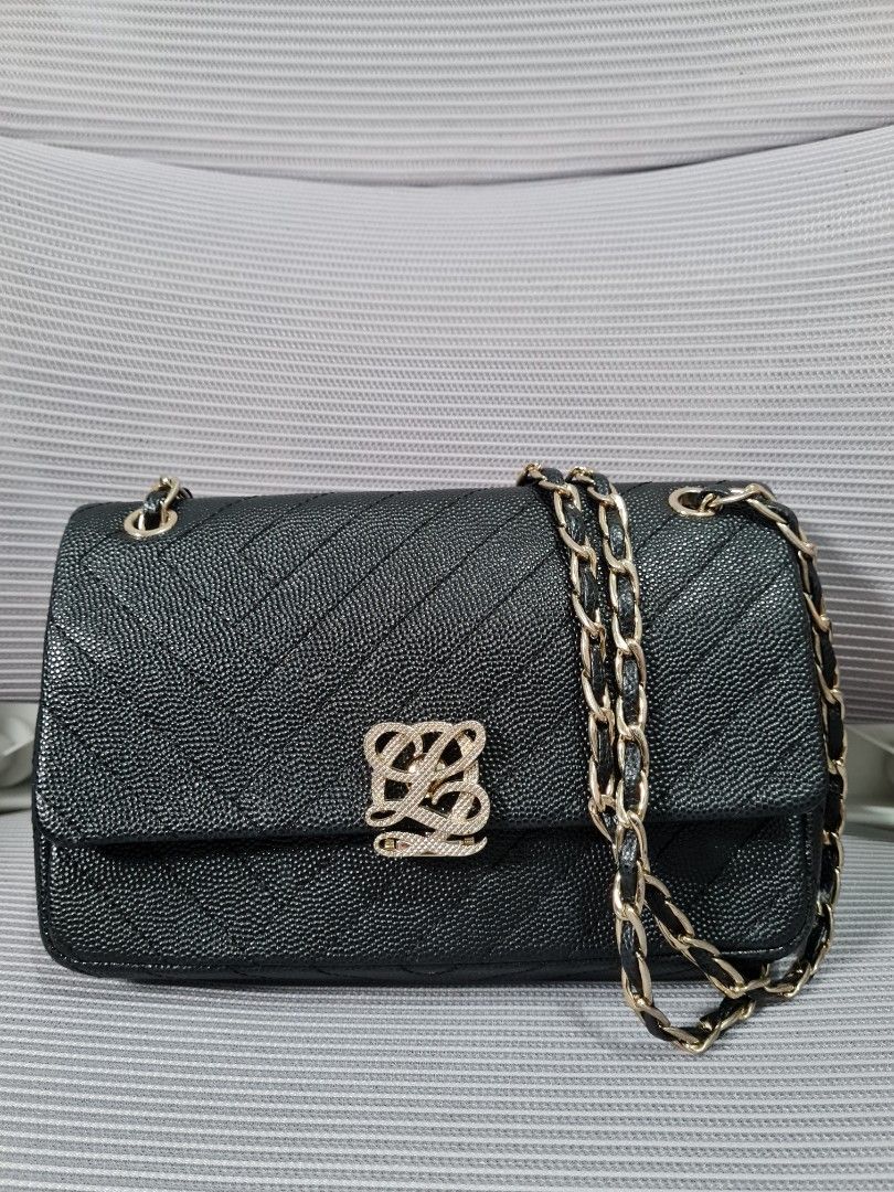 LQ Purse with Chain (Category: Purses & Pouches) located in Quezon City. Submitted by missmaui (Listing ID 1461781759, Image 1). Description: This model belongs to the Louis Quatorze L-Quilting line. Key details of this specific style: * Style: Chevron (V-quilted) / L-Quilted Caviar Leather Flap Bag with Woven Chain Strap * Material: Black pebbled (caviar) cowhide leather * Hardware: Light gold/champagne gold LQ monogram turn-lock clasp and chain