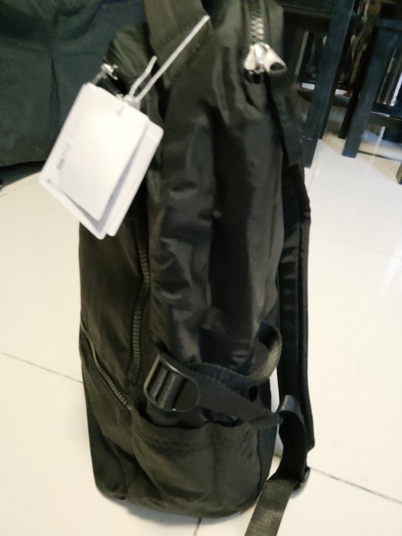 Lululemon Black Backpack Est. 1998 (Category: Backpacks) located in Manila. Submitted by wildwind_73f77a (Listing ID 1461608144, Image 3). Description: - Black Lululemon backpack - Features the Lululemon est. 1998 logo on the front - Multiple zippered compartments for organized storage - Adjustable straps for a comfortable fit - Plenty of interior space, ideal for everyday use or travel.
