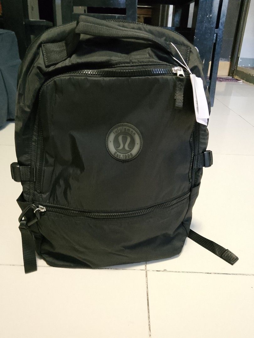 Lululemon Black Backpack Est. 1998 (Category: Backpacks) located in Manila. Submitted by wildwind_73f77a (Listing ID 1461608144, Image 2). Description: - Black Lululemon backpack - Features the Lululemon est. 1998 logo on the front - Multiple zippered compartments for organized storage - Adjustable straps for a comfortable fit - Plenty of interior space, ideal for everyday use or travel.